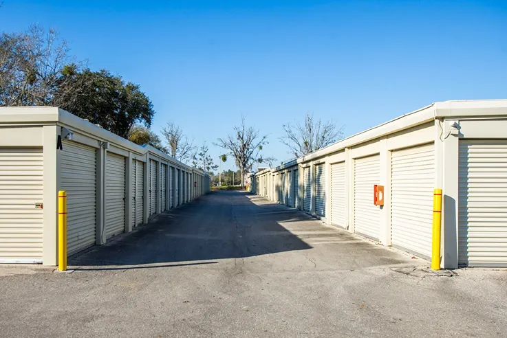 Drive-up storage units with wide access lanes for easy vehicle loading